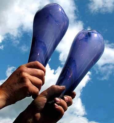 person holding blue bottles