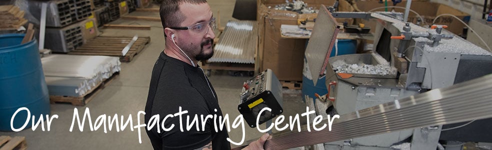 Employee working with metal building materials